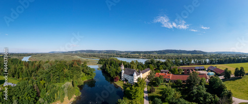 Austria, Upper Austria, Sankt Peter am Hart, Panoramic view of river Mattig and Hagenau Castle photo