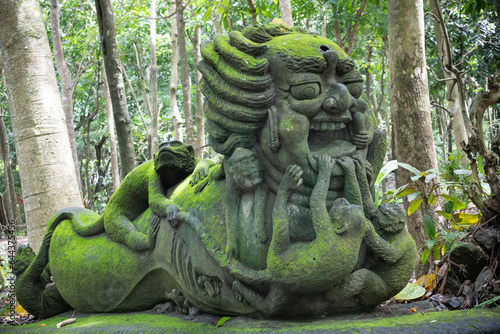 Stutue in Sacred Monkey Forest in Ubud, Bali, Indonesia. photo