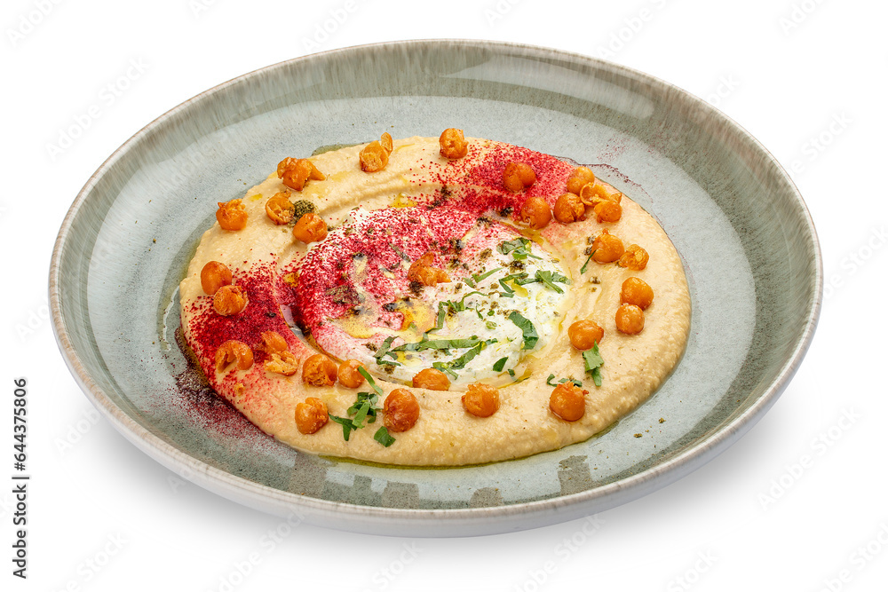 Chickpea hummus on a decorative ceramic plate. White background. Chickpea hummus on a decorative ceramic plate. White background.