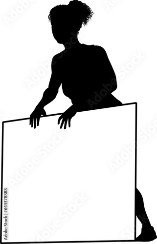 Protestor or demonstrator at a demonstration march, picket line or strike protest rally in silhouette. Holding up a banner or picket sign board placard.
