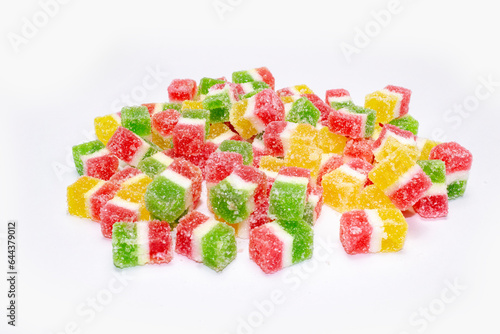colorful marmalade cubes in sugar on white background