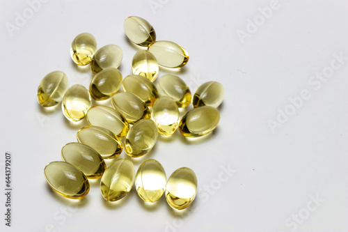 Transparent capsules of yellow vitamins