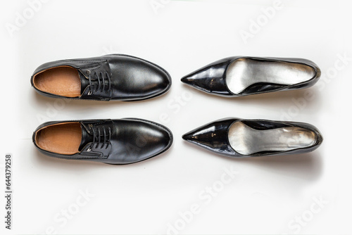 modern fashionable classic shoes, men's and women's shoes on a white background top view.
