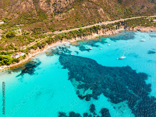 Drone view of a beach with perfect blue water in Sardinia Italy. luxury travel destination