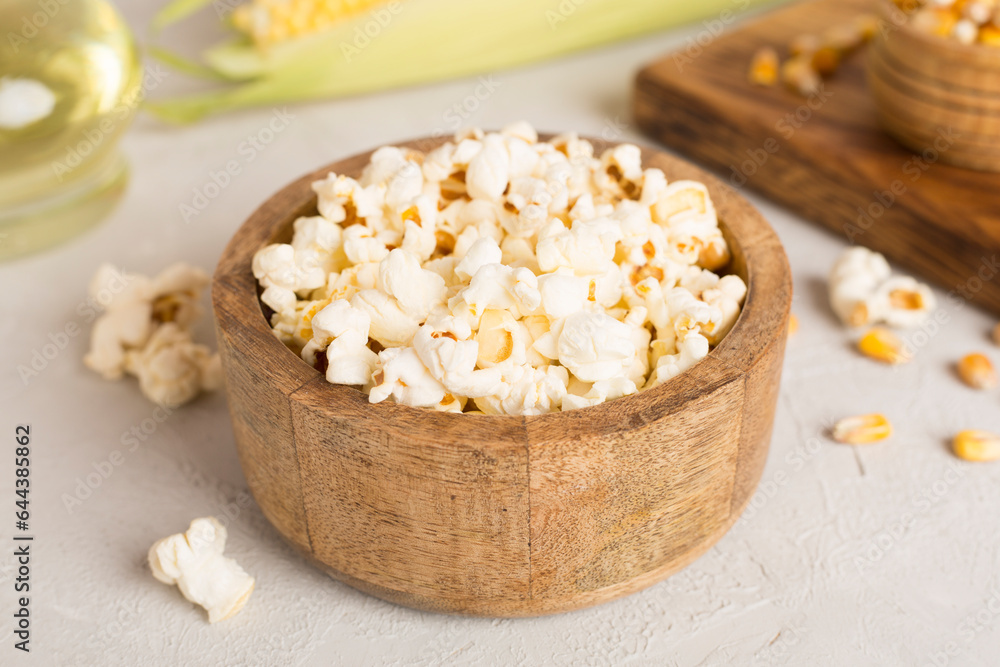 Prepared popcorn with ingredients on wooden table Prepared popcorn with ingredients on wooden table
