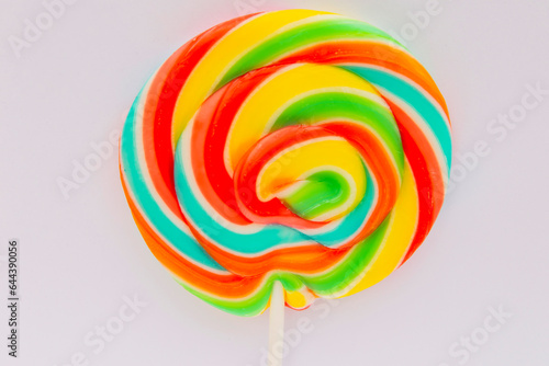 round multi-colored candy lollipop close-up on a stick