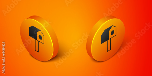 Isometric Bird house icon isolated on orange background. Nesting box birdhouse, homemade building for birds. Orange circle button. Vector