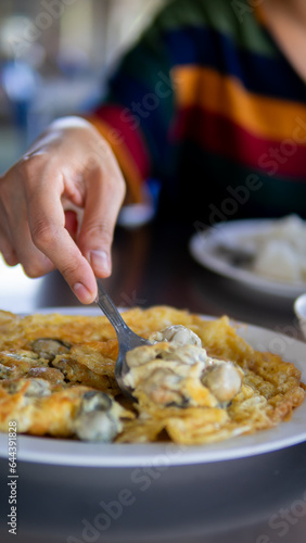 Close up women eating seafood