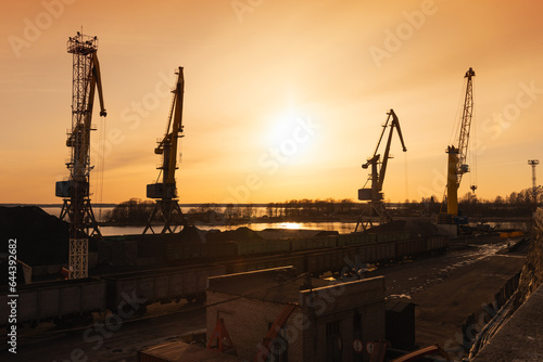 Vyborg coal terminal. Silhouettes of portal cranes photo