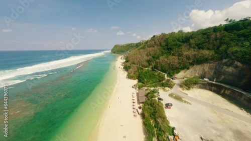 White sand beach in Bali (Indonesia)— FPV drone aerial view. Travel video