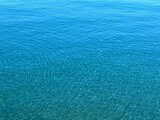Blue water sea surface, blue ocean background, aqua waves