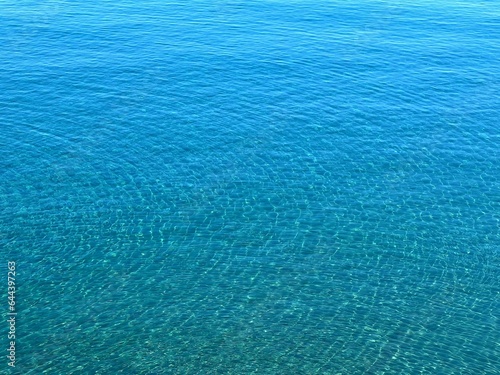 Blue water sea surface, blue ocean background, aqua waves