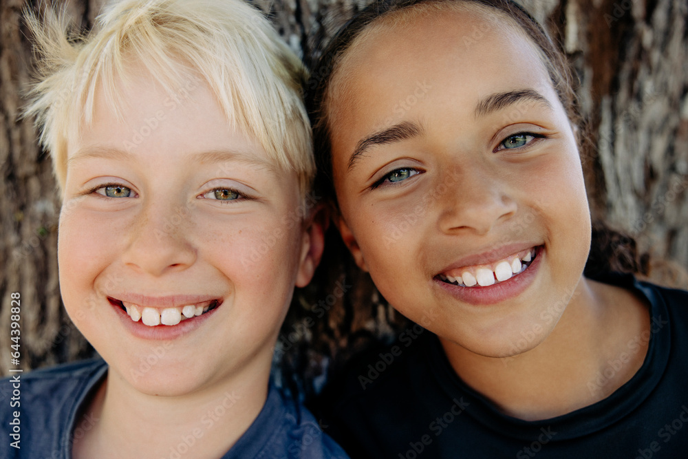 Portrait of smiling blond boy with female friend at summer camp Portrait of smiling blond boy with female friend at summer camp