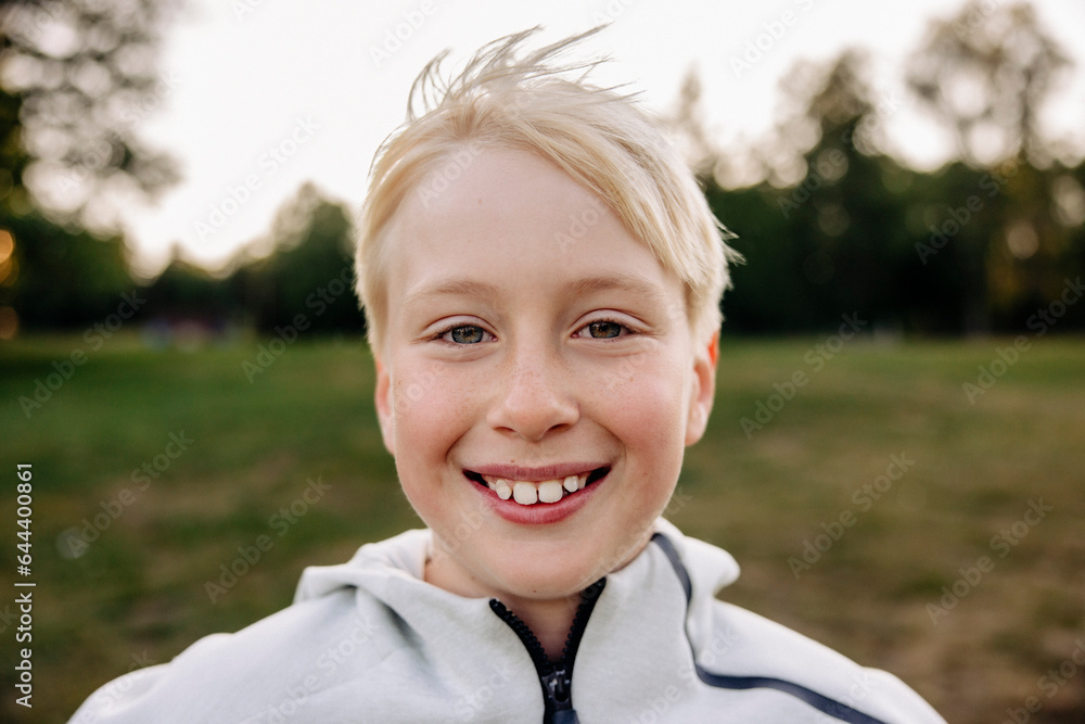 Portrait of smiling blond boy in playground Portrait of smiling blond boy in playground