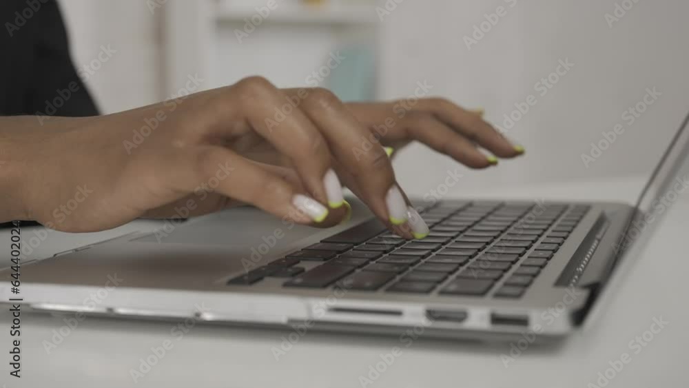 Modern businesswoman creative concept. Closeup shot of the woman at the desk, female hands typing something on laptop keyboard. HDR BT2020 HLG Material. Modern businesswoman creative concept. Closeup shot of the woman at the desk, female hands typing something on laptop keyboard. HDR BT2020 HLG Material.