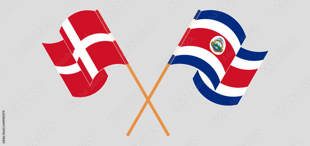 Crossed and waving flags of Denmark and Costa Rica