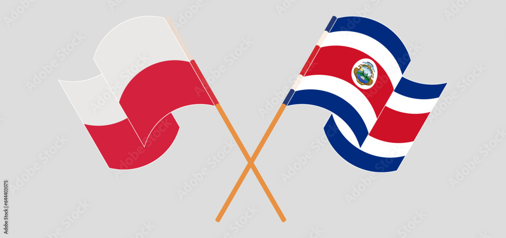 Crossed and waving flags of Poland and Costa Rica Crossed and waving flags of Poland and Costa Rica