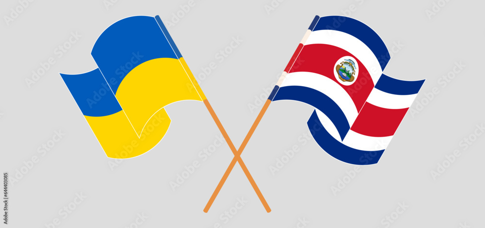 Crossed and waving flags of Ukraine and Costa Rica Crossed and waving flags of Ukraine and Costa Rica