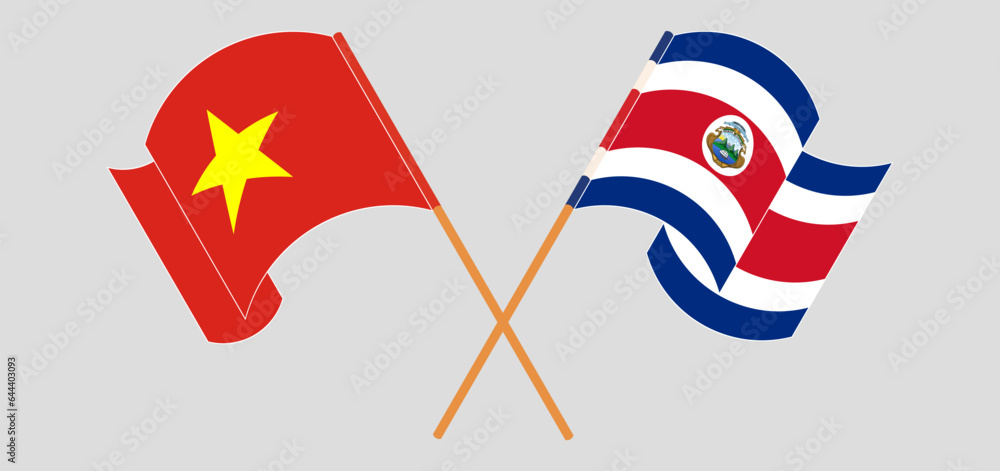 Crossed and waving flags of Vietnam and Costa Rica