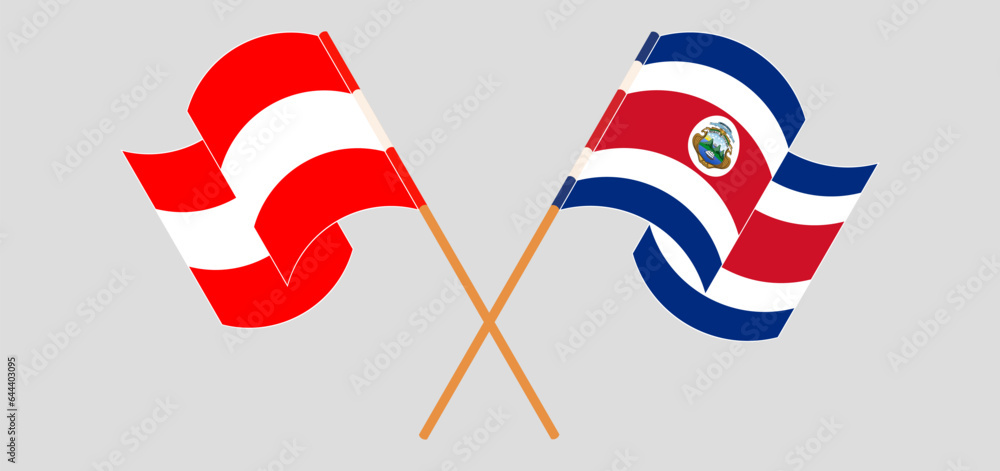 Crossed and waving flags of Austria and Costa Rica