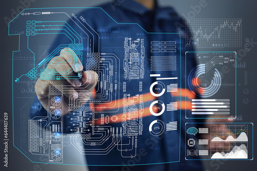 Engineer working on single line diagram of power system circuit board factory support facility management power energy electricity water gas piping supply to machinery cooling heating ventilation.