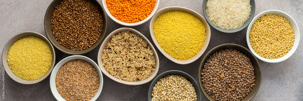 Various grain cereals in bowls banner, top view Various grain cereals in bowls banner, top view