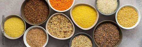Various grain cereals in bowls banner, top view