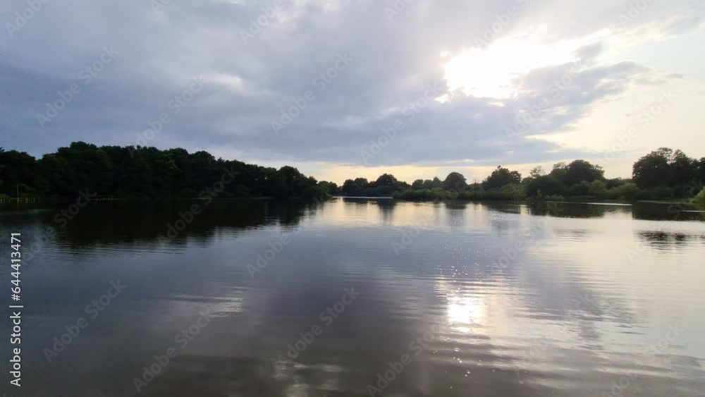 Beautiful view of a lake with raindrops falling into the water. Beautiful view of a lake with raindrops falling into the water.