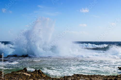 Wild part of the coast with water splashing on rocks, Bonaire, Dutch Caribbean.