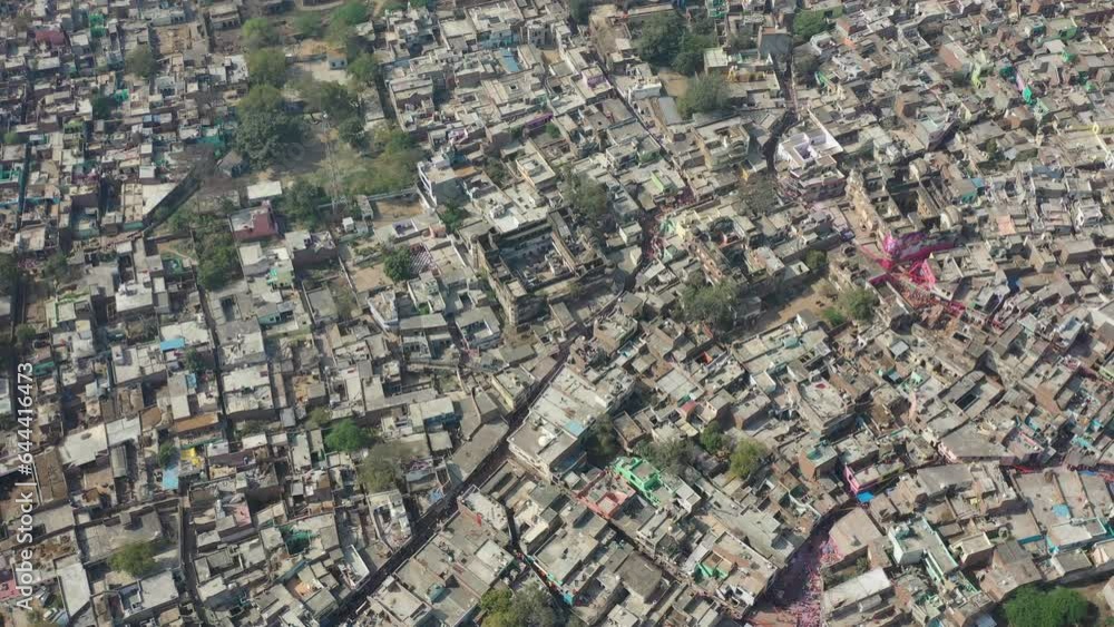 Aerial view of people celebrating the holy colour festival in the street in Barsana, Uttar Pradesh, India. Aerial view of people celebrating the holy colour festival in the street in Barsana, Uttar Pradesh, India.