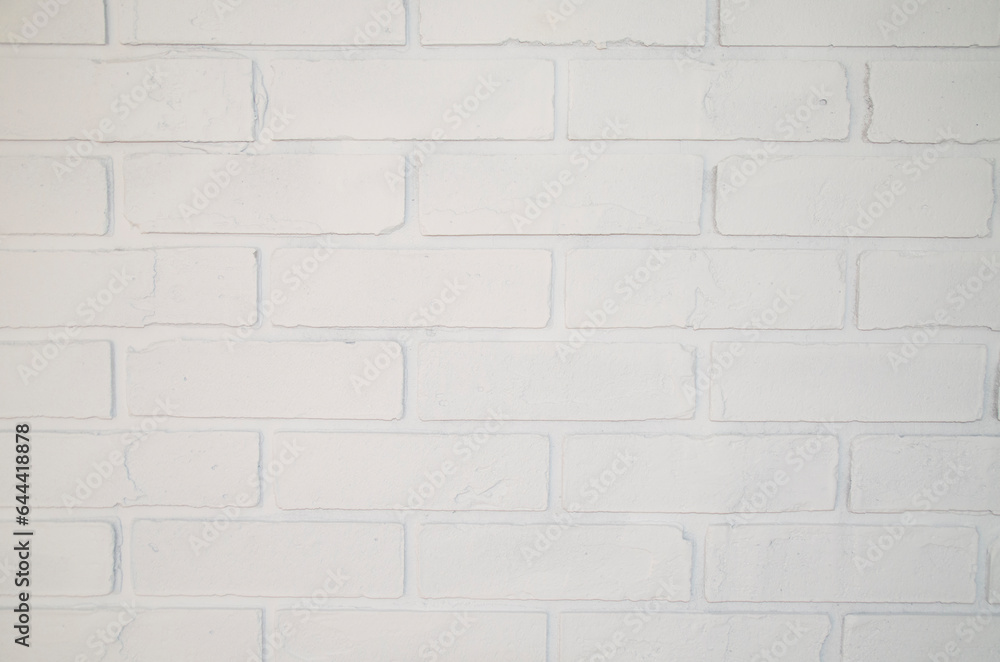 Obraz premium Brick white wall close-up. Grunge-style background.