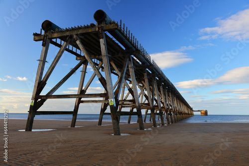 View of a Beach and Wooden Pier on a sunny day, Hartlepool, England, UK.