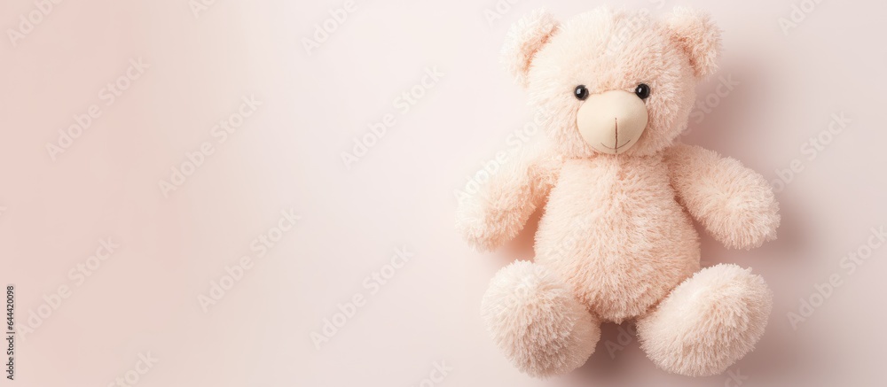 White isolated pastel background Copy space with soft toy bear and heart shaped paws White isolated pastel background Copy space with soft toy bear and heart shaped paws