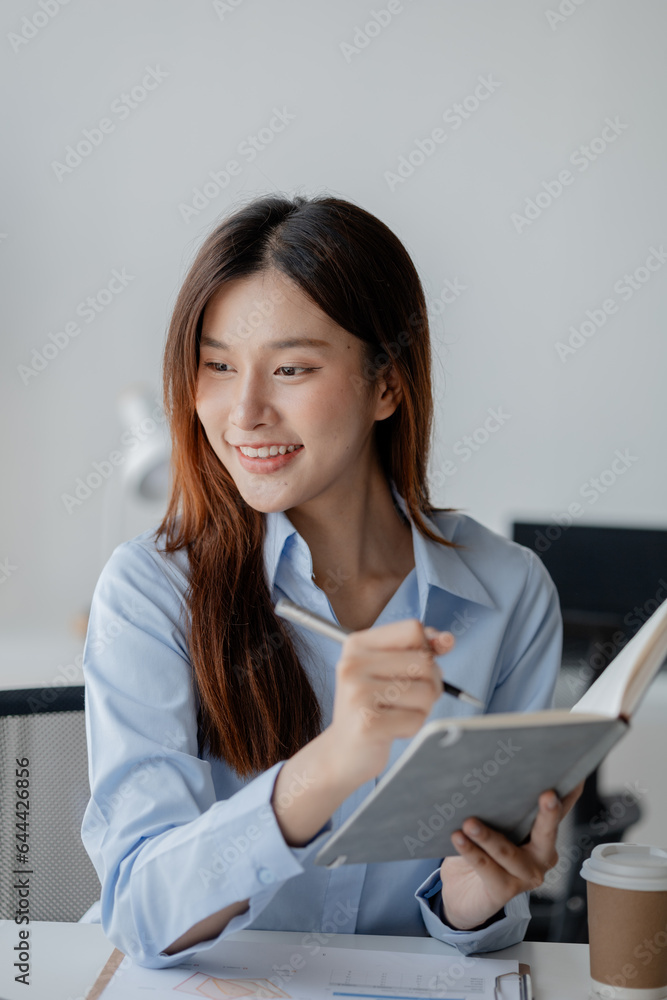 Asian woman sitting in startup company office, businesswoman, executive and investor in business and stocks, management of young people, new concept. Start-up company management concepts. Asian woman sitting in startup company office, businesswoman, executive and investor in business and stocks, management of young people, new concept. Start-up company management concepts.