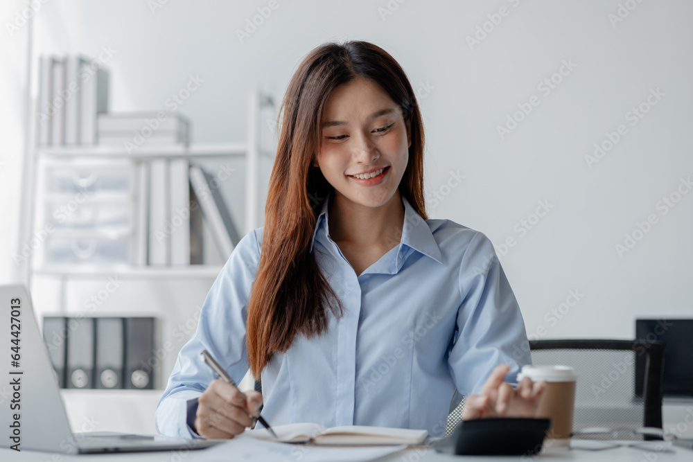 Asian woman sitting in startup company office, businesswoman, executive and investor in business and stocks, management of young people, new concept. Start-up company management concepts. Asian woman sitting in startup company office, businesswoman, executive and investor in business and stocks, management of young people, new concept. Start-up company management concepts.