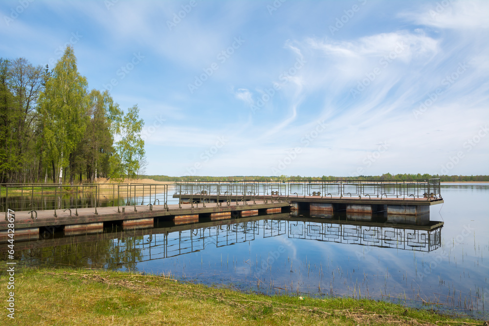 Metal pontoon bridge on the lake Braslav , Belarus. Metal pontoon bridge on the lake Braslav , Belarus.