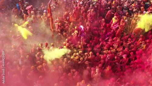 Barsana, India - 28 February 2023: Aerial view of people celebrating the holy colour festival in the street in Barsana, Uttar Pradesh, India. photo