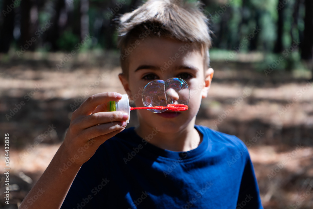 Child playing with soap bubbles Child playing with soap bubbles