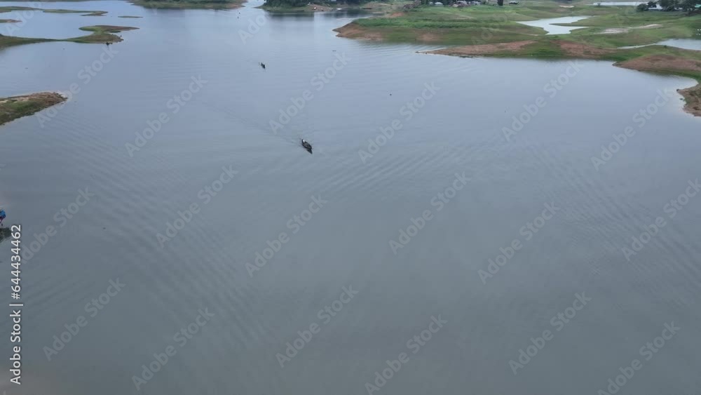 Aerial view of floating market of seasonal fruits on the boats in Kaptai Lake, Rangamati, Bangladesh. Aerial view of floating market of seasonal fruits on the boats in Kaptai Lake, Rangamati, Bangladesh.