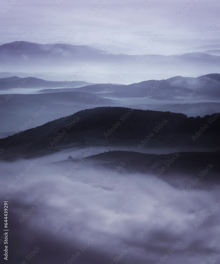 aerial view of fog covering hills, dark fantasy landscape