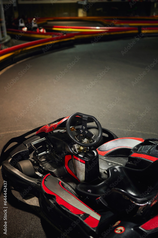 go cart kart for racing, red racing car inside of indoor kart circuit, motor race vehicle