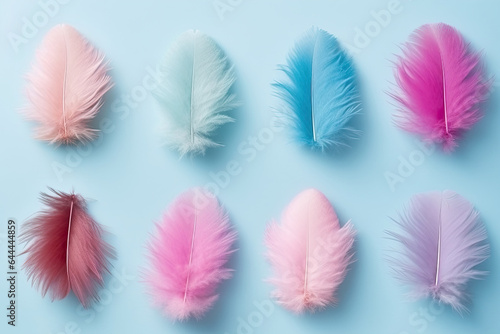Easter background with Assorted Colorful Feathers on blue background.