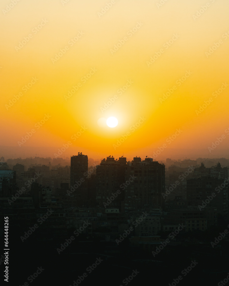 aerial view of the sunset of cairo city in egypt. Panoramic view of buildings and skyscrapers of the city with an incredibly spectacular sunset or sunrise. 