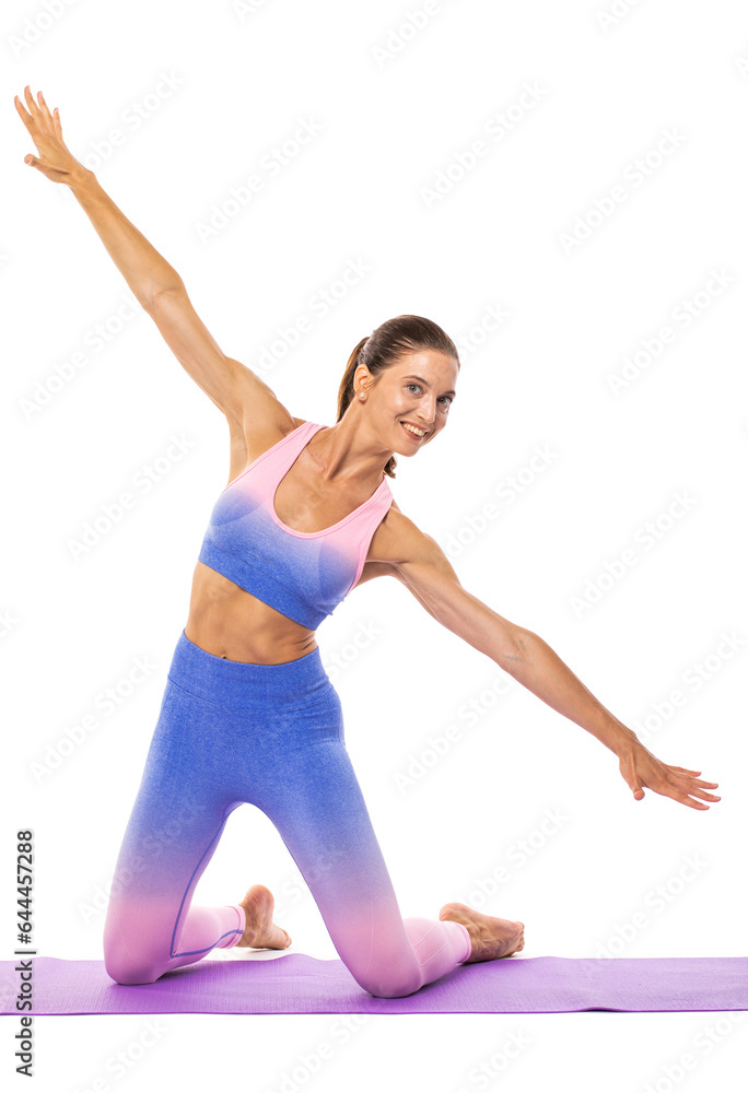 Happy young athletic woman doing gymnastics - isolated on white background Happy young athletic woman doing gymnastics - isolated on white background