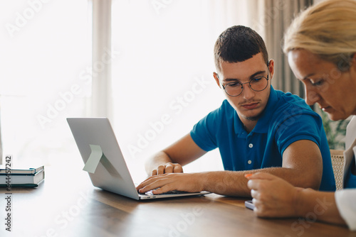 Mother and son shopping online