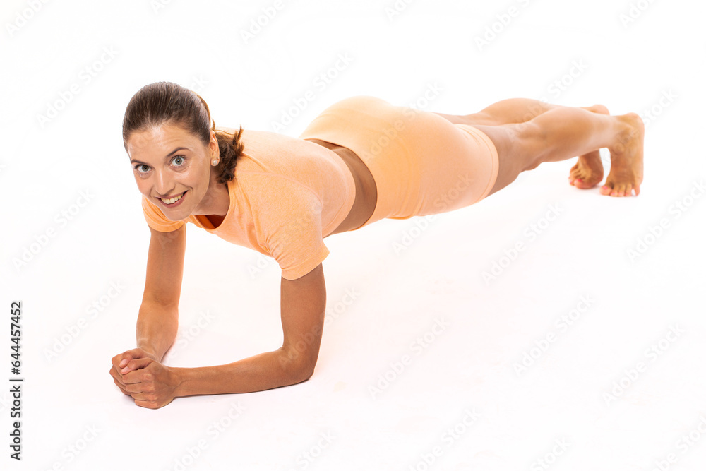 Young athletic woman posing in studio, isolated on white background Young athletic woman posing in studio, isolated on white background