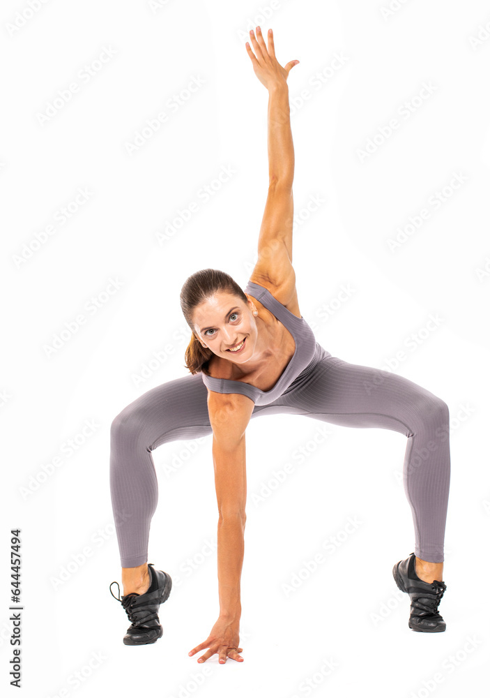 Happy young athletic woman doing gymnastics - isolated on white background Happy young athletic woman doing gymnastics - isolated on white background