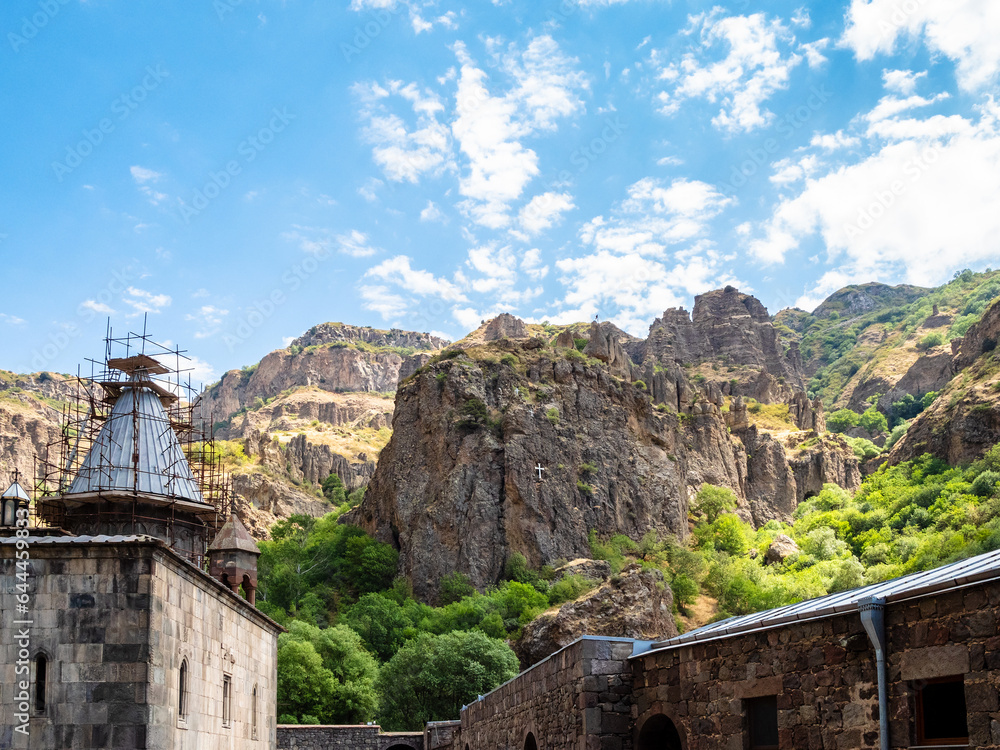 view from courtyard of medieval monastery of Geghard to rocks on sunny summer day, Armenia