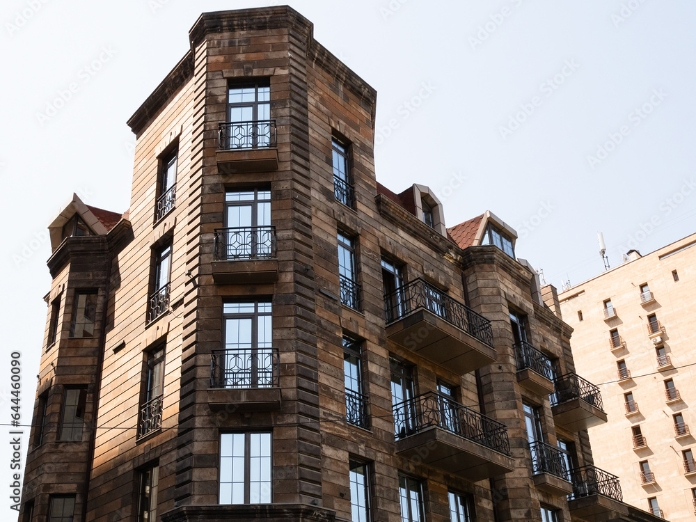 Fototapeta premium apartment house on street corner of Pavstos Buzand and Yeznik Koghbatsi street in Yerevan city, Armenia