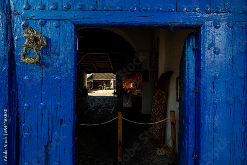 Blue wooden portal with the open access door © Toyakisfoto.photos